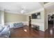 Bright living room with hardwood floors, white trim, and a decorative ceiling fan at 1231 Hillview Rd, Hampton, GA 30228