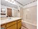 Bathroom featuring a single sink, vanity, mirror, and shower-tub combo at 110 Thompson Blvd, Stockbridge, GA 30281
