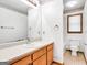 A well-lit bathroom features a vanity with storage, and a window for fresh light and ventilation at 110 Thompson Blvd, Stockbridge, GA 30281