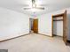 Spacious bedroom with neutral color palette, baseboard trim, and doorways at 110 Thompson Blvd, Stockbridge, GA 30281