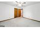 This bedroom has a window, baseboard trim, doors, and ceiling fan at 110 Thompson Blvd, Stockbridge, GA 30281