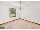 Dining room with a light fixture and a view to the outside from a window at 110 Thompson Blvd, Stockbridge, GA 30281