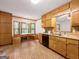 Eat-in kitchen includes wood cabinets, a breakfast nook, and tile flooring at 110 Thompson Blvd, Stockbridge, GA 30281