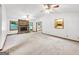 Spacious living room with fireplace, large windows and neutral carpet at 110 Thompson Blvd, Stockbridge, GA 30281