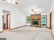 Spacious living room featuring fireplace, large windows, and neutral color palette at 110 Thompson Blvd, Stockbridge, GA 30281