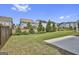 View of a fully fenced backyard with a large lawn and landscaping at 307 Owenberg Trce, Peachtree City, GA 30269