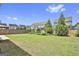Spacious backyard with a wooden fence and mature landscaping at 307 Owenberg Trce, Peachtree City, GA 30269