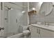 Modern bathroom with a glass-enclosed shower, gray accent wall, and a vanity with marble countertop at 307 Owenberg Trce, Peachtree City, GA 30269