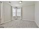 Bedroom featuring neutral walls, carpet, and natural light from two windows at 307 Owenberg Trce, Peachtree City, GA 30269