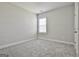Bedroom featuring neutral walls, carpet, and a window providing natural light at 307 Owenberg Trce, Peachtree City, GA 30269