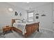 Charming bedroom with a wood bed, bedside table, and tasteful decor at 307 Owenberg Trce, Peachtree City, GA 30269