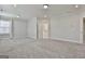 Spacious bedroom with neutral walls, carpet, and ensuite bathroom access at 307 Owenberg Trce, Peachtree City, GA 30269