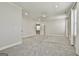 Large bedroom with neutral walls and carpet, featuring access to an ensuite bathroom at 307 Owenberg Trce, Peachtree City, GA 30269