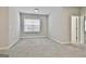 Spacious bedroom with neutral colors and large window, ready for your personal touch at 307 Owenberg Trce, Peachtree City, GA 30269