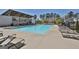 Community pool area featuring lounge chairs and covered patio at 307 Owenberg Trce, Peachtree City, GA 30269