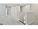 Second floor hallway with carpet flooring and neutral paint colors at 307 Owenberg Trce, Peachtree City, GA 30269