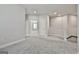 Upstairs hallway features neutral carpet, paint and provides access to the bedrooms at 307 Owenberg Trce, Peachtree City, GA 30269