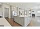 Modern kitchen features an island, stainless steel appliances and an open concept design at 307 Owenberg Trce, Peachtree City, GA 30269