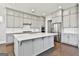 Well-equipped kitchen with large island, stainless steel appliances, and plenty of storage at 307 Owenberg Trce, Peachtree City, GA 30269