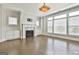 Spacious living room features a fireplace, built-in cabinets, and large windows at 307 Owenberg Trce, Peachtree City, GA 30269