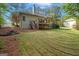 Large backyard featuring a deck, fire pit and ample space for outdoor activities at 2698 Pleasant Grove Church Rd, Villa Rica, GA 30180