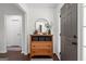 Bright foyer with wood floors, a stylish console table, and a decorative mirror at 2698 Pleasant Grove Church Rd, Villa Rica, GA 30180
