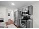 This contemporary kitchen showcases stainless steel appliances, gray cabinets, and stone countertops at 2698 Pleasant Grove Church Rd, Villa Rica, GA 30180