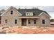 Charming brick home with a covered porch and classic architectural details at 1705 Lake Dow Rd, Mcdonough, GA 30252