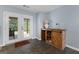 The bar area features a wooden cabinet, sink, and access to the backyard through double glass doors at 1112 Haver Ct, Mcdonough, GA 30252