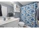 Clean bathroom with white vanity, patterned shower curtain, and ample storage at 1112 Haver Ct, Mcdonough, GA 30252