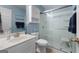 Bathroom featuring tiled floors, a vanity, toilet, medicine cabinet, and a glass-enclosed shower at 1112 Haver Ct, Mcdonough, GA 30252