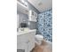 Bright bathroom with white vanity, patterned shower curtain, and tile flooring at 1112 Haver Ct, Mcdonough, GA 30252