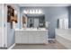 A full bathroom features a double sink vanity with a large mirror and tile floors at 1112 Haver Ct, Mcdonough, GA 30252