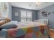 Inviting bedroom with wood floors, ceiling fan, and natural light; Bedroom space included at 1112 Haver Ct, Mcdonough, GA 30252