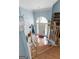 Bright foyer with hardwood floors, staircase, light blue walls, and natural light at 1112 Haver Ct, Mcdonough, GA 30252