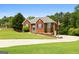 Inviting brick home with manicured lawn, charming front entrance, and well-maintained landscaping at 1112 Haver Ct, Mcdonough, GA 30252