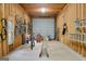 Spacious garage with exposed wood framing, concrete floor, and ample storage, ideal for projects and vehicles at 1112 Haver Ct, Mcdonough, GA 30252