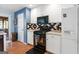 The kitchen features a black gas range stove, stainless steel microwave, and white cabinets at 1112 Haver Ct, Mcdonough, GA 30252