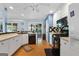 A kitchen features a black gas range stove, stainless steel dishwasher, and white cabinets at 1112 Haver Ct, Mcdonough, GA 30252