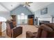 Cozy living room with vaulted ceiling, fireplace, and comfortable seating, bathed in natural light at 1112 Haver Ct, Mcdonough, GA 30252
