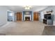 Large living room features a cozy brick fireplace, wood built-ins, and lots of room for entertaining at 1112 Haver Ct, Mcdonough, GA 30252