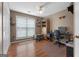 Cozy office features wood floors, ceiling fan, large window and ample built-in storage at 1112 Haver Ct, Mcdonough, GA 30252