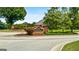 Welcoming Pleasant Grove community entrance with brick signage and well-manicured landscaping on a sunny day at 1112 Haver Ct, Mcdonough, GA 30252