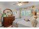 Charming bedroom with a large dresser, a comfy bed, and natural light at 118 Duvall Dr, Stockbridge, GA 30281