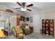 Cozy bedroom featuring decorative furniture, carpet floors, and a ceiling fan at 118 Duvall Dr, Stockbridge, GA 30281