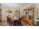 Formal dining room with hardwood floors, ornate furniture, and a charming, vintage aesthetic at 118 Duvall Dr, Stockbridge, GA 30281
