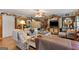Inviting living room featuring hardwood floors, ample seating, and a large TV with built-ins at 118 Duvall Dr, Stockbridge, GA 30281