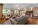 Cozy living room with a brick fireplace, hardwood floors, and inviting, neutral decor at 118 Duvall Dr, Stockbridge, GA 30281