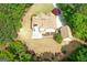 Aerial view of a large home with a spacious backyard surrounded by lush greenery, offering privacy and tranquility at 21 Highbush Ct, Sharpsburg, GA 30277