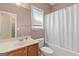 This bathroom includes a white shower curtain, a toilet, and a sink with a mirror above it at 21 Highbush Ct, Sharpsburg, GA 30277